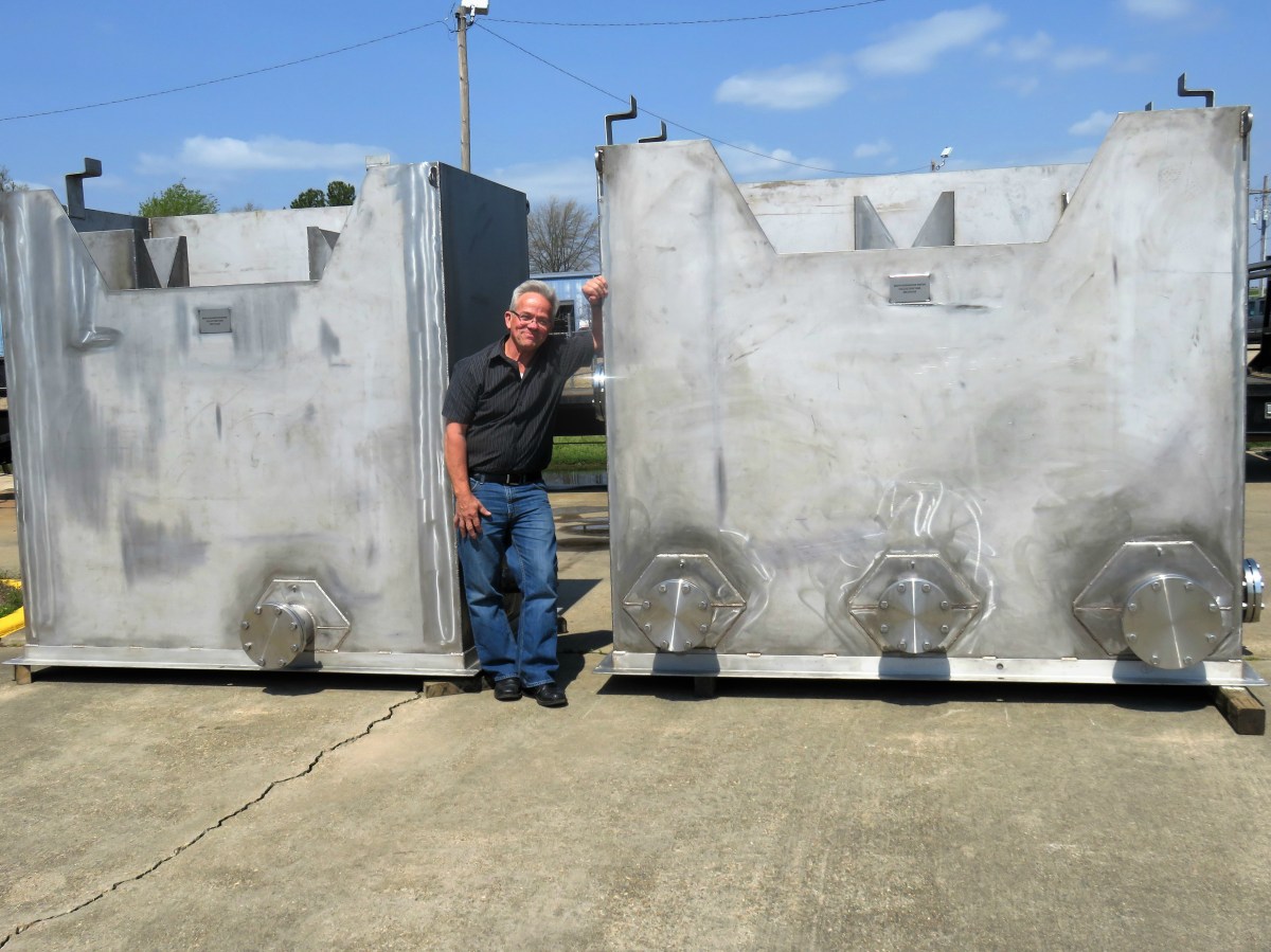 Pat Fink with Domtar's separator water collection tank